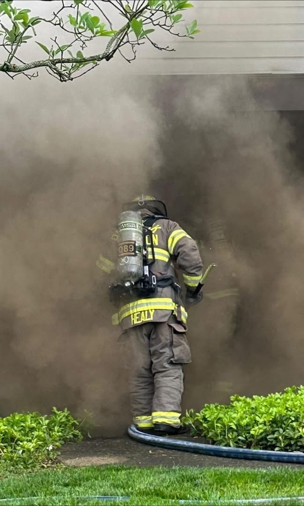 firefighter in smoking building 